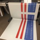 13 oz vinyl or even 18 oz vinyl banners, matte or glossy banners, hemmed and grommets.